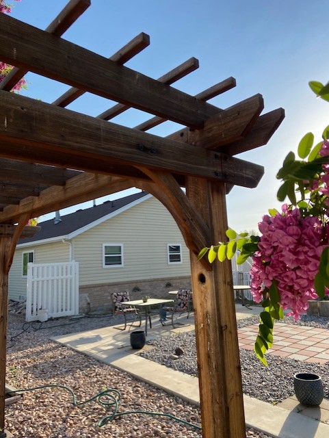 Pergola with hole next to house